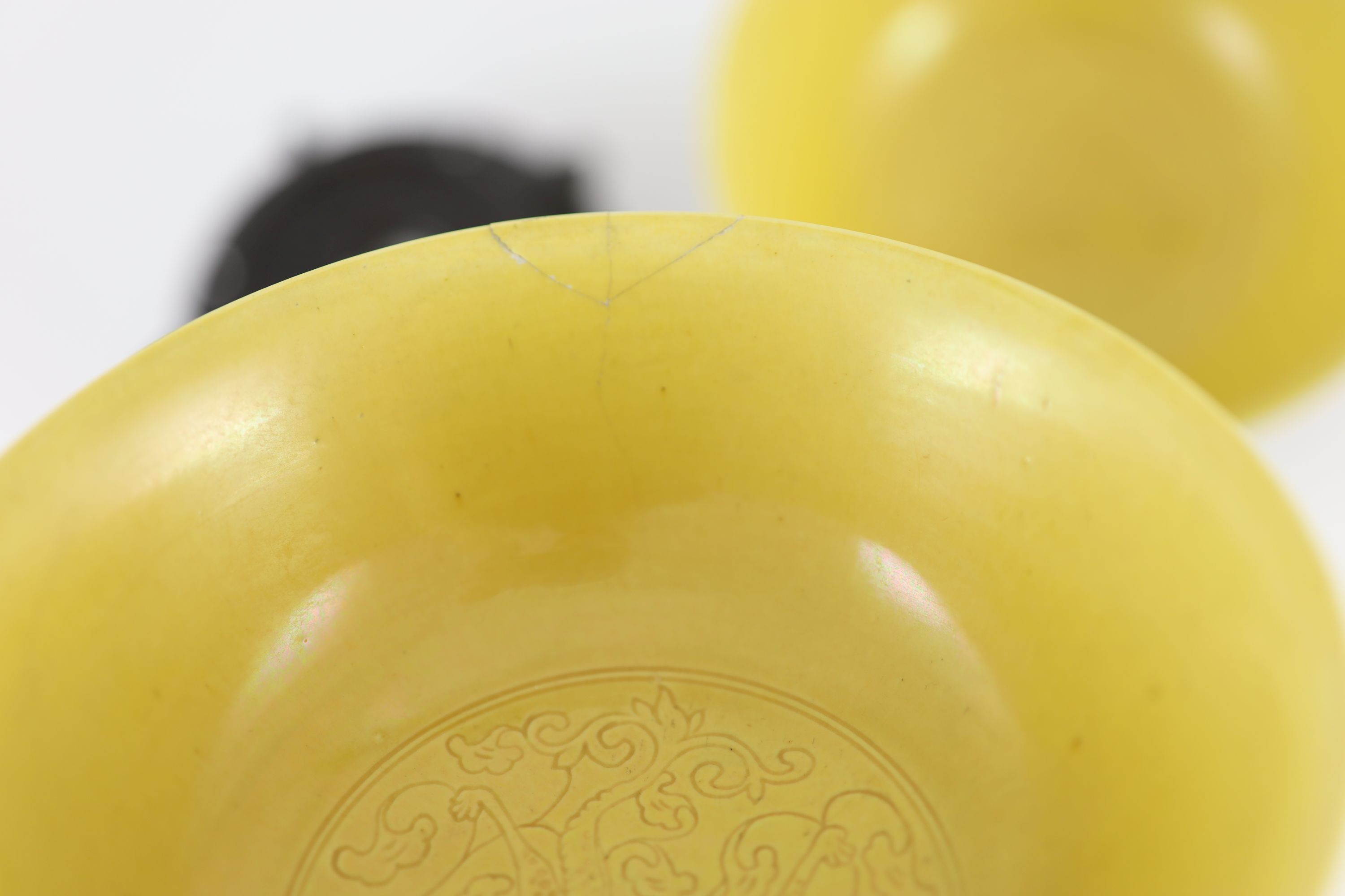 A pair of Chinese yellow ground sgraffito bowls, Kangxi mark but mid 20th century,